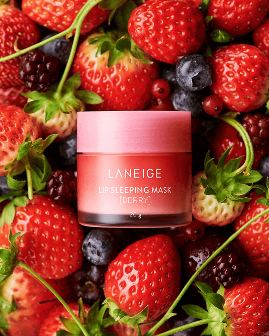Laneige Lip Sleeping Mask Berry surrounded by fresh berries, offering deep moisture for soft, hydrated lips.