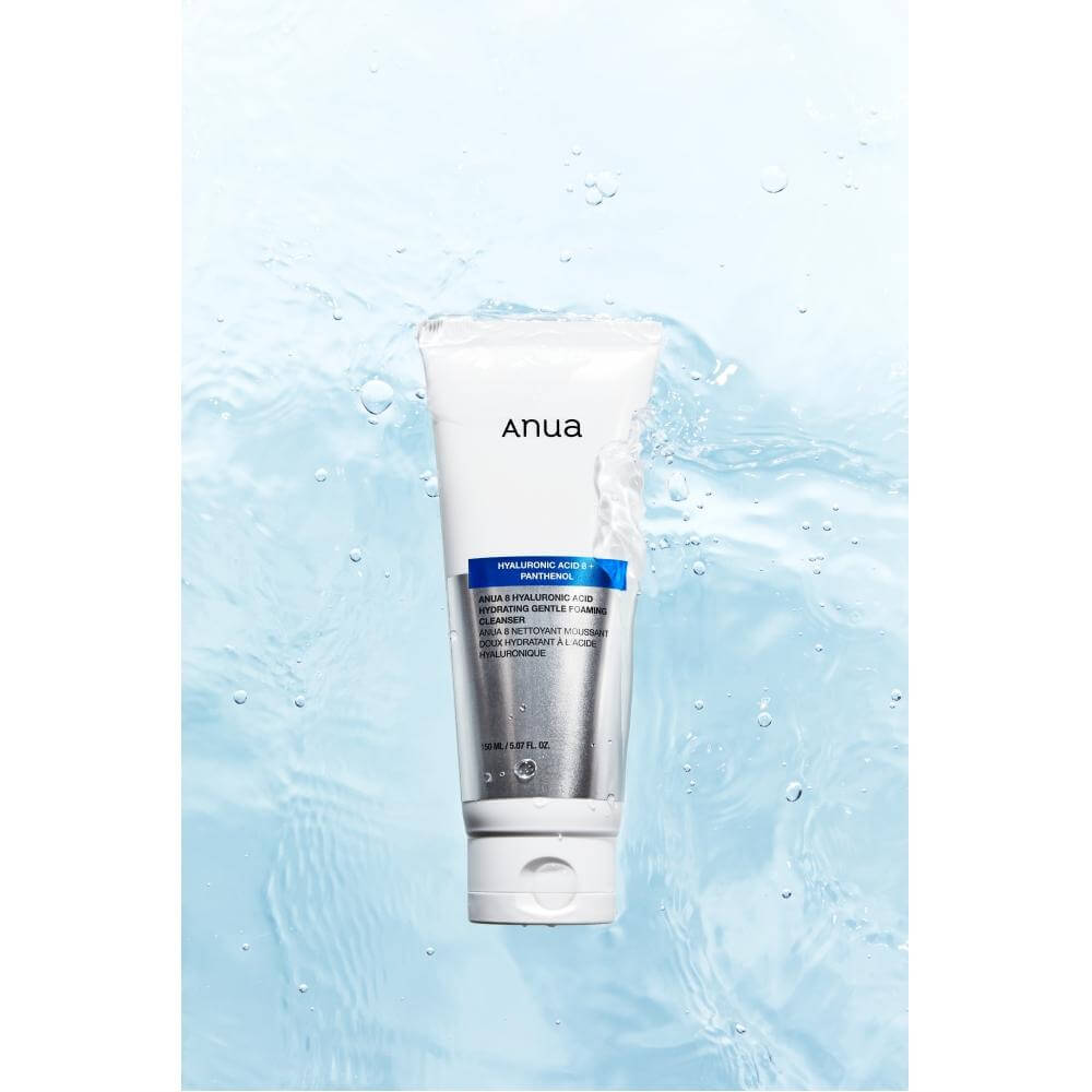 Anua 8 Hyaluronic Acid Hydrating Gentle Foaming Cleanser in a tube, designed to hydrate and soothe all skin types against a watery background.