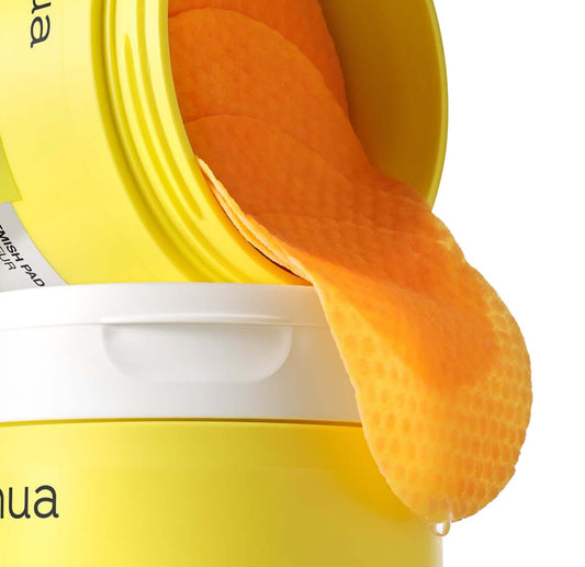 Anua Vitamin C Niacin Tone Up Blemish Pad container with orange toner pads visible.