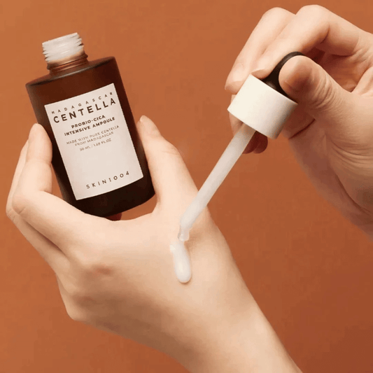 Skin1004 Madagascar Centella Probio-Cica Intensive Ampoule being applied to hand for hydration and skin soothing.