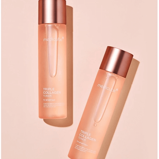 Medicube Triple Collagen Toner bottles on a pink background showcasing hydration and skin suppleness.