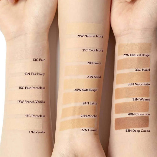 Swatches of foundation shades including 13C Fair, 21W Natural Ivory, 29N Natural Beige, and more on arms.