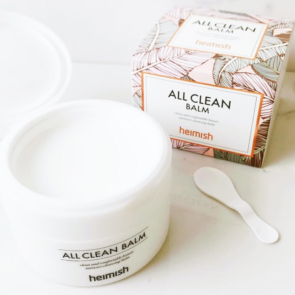 Heimish All Clean Balm 120ml in a jar with a spatula and floral packaging, ideal for gentle cleansing and hydration.