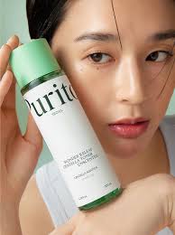 Purito Seoul Wonder Releaf Centella Toner in hand, showcasing its hydrating formula for sensitive skin.