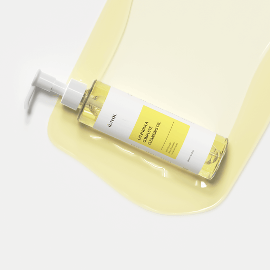 iUNIK Calendula Complete Cleansing Oil 200ml with gentle oil on a smooth surface