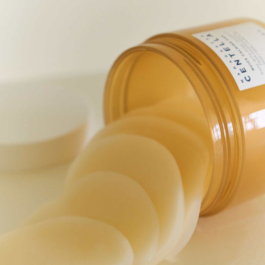 SKIN1004 Madagascar Centella Quick Calming Pad in a jar with pads pouring out for soothing irritated skin.